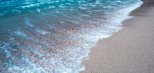 Background of a beach with white sand and lovely tiny waves