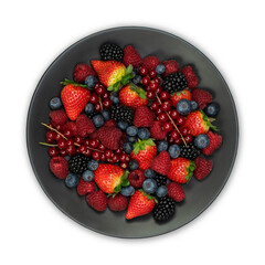Raspberries, blackberries and blueberries on a black plate, food closeup