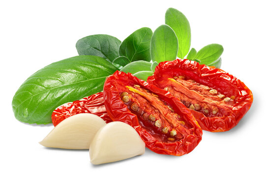 Dried or Sundried tomato halves with herbs and garlic  isolated png