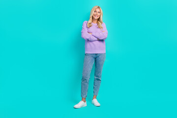 Fototapeta premium Full length photo of pretty positive lady crossed arms look empty space isolated on turquoise color background