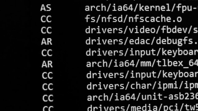 Code. Server logs on a monitor scroll by showing information related to scanning and network activity. File check and security. Concept background for video about technology and digital transformation
