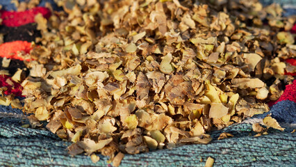 Ginger or adrak known as (Zingiber officinale). Ginger roots peeled with knife over chopping block. Top view