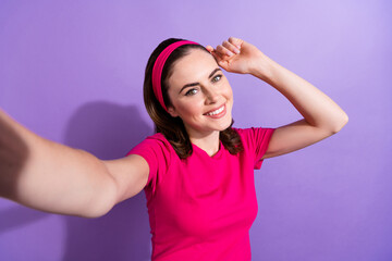 Photo of positive sporty lady share live stream enjoy hobby time fitness outdoors isolated on purple color background