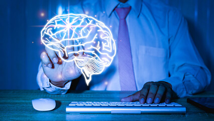 Close up of businessman hand holding brain in palm, Virtual reality man with symbol neurons in the...