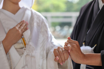 Japanese kimono bride and groom holding hands