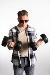 Casual guy lifting a weight isolated on white background