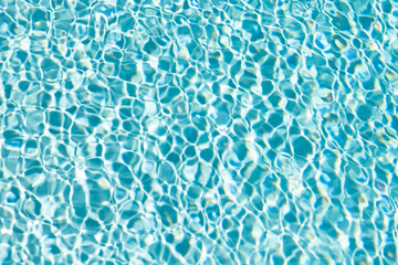 rippled water backdrop blue color in summer swimming pool