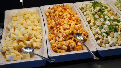 Assortment of chopped cheese with spices