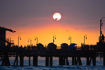 silhouette of a santa monica pier at sunset