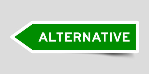 Green color arrow shape sticker label with word alternative on gray background