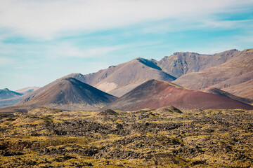 Red volcanic mountains near Selvallavatn lake, typical Iceland landscape