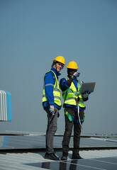 Both of Engineer in charge of solar panel installation The installation of solar energy conversion into electricity for a warehouse is currently being investigated.