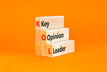 KOL key opinion leader symbol. Concept words KOL key opinion leader on wooden blocks on a beautiful...