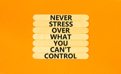 Never stress symbol. Concept words Never stress what you can not control on wooden sticks. Beautiful orange table orange background copy space. Business control motivational never stress concept.