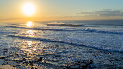 Beach Ocean Waves Horizon Sunrise Overlooking Scenic natural coastline landscape.