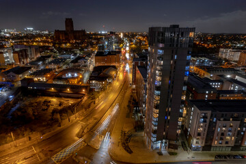 Fototapeta na wymiar Aerial Skyline at night in Liverpool with streaked lights of traffic below