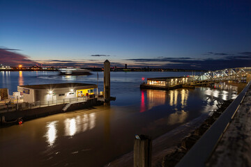 Ferry dock on the River Mersey Liverpool, long exposure of ferry passing at sunset