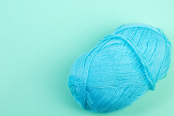 Knitting yarn for knitting on green background.