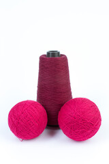 Knitting yarn for knitting on white background. red.