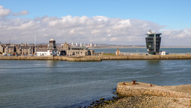 View across the harbour entrance with the city of Aberdeen beyond