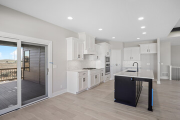 Modern home and kitchen with white cabinets by Hildy Homes in Omaha Nebraska