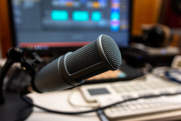 Professional microphone on a working table in a recording studio
