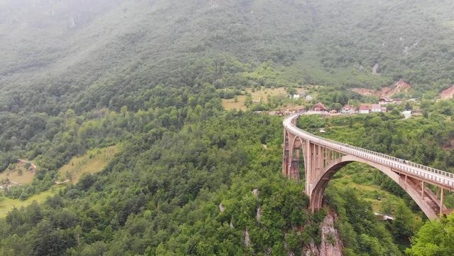 Aerial of Djurdjevica Bridge over Tara river canyon in Montenegro. Grerat tourist attraction and unique architectural structure