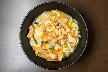 Chicken udon soup in a bowl