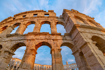 Pula Amphitheater at sunset, also known as Coliseum of Pula, is a well-preserved Roman amphitheater...