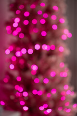 abstract Bokeh of pink lights in Christmas tree de focus to make blurry circles celebration festive bright pink blurry circles for festive backdrop or background aperture setting for bokeh creativity 