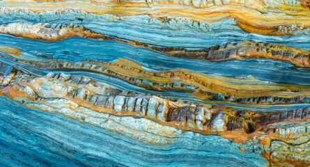 Close-up of smooth sanded colorful rocks on the coast of Asturias