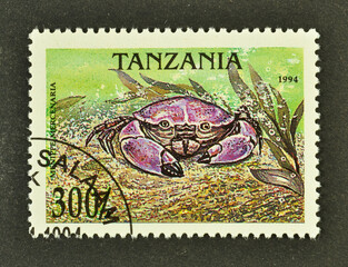 Cancelled postage stamp printed by Tanzania, that shows Florida Stone Crab (Menippe mercenaria),...