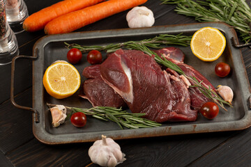 On the tray is a meat tenderloin, the flesh of a roe deer, a wild animal © Natalya Ugryumova