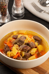 Roe deer meat stewed with potatoes, onions and carrots with spices