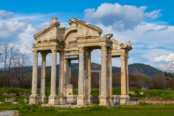Fototapeta na wymiar Famous Tetrapylon Gate in Aphrodisias ancient city. Archaeological and historical sites of modern Turkey
