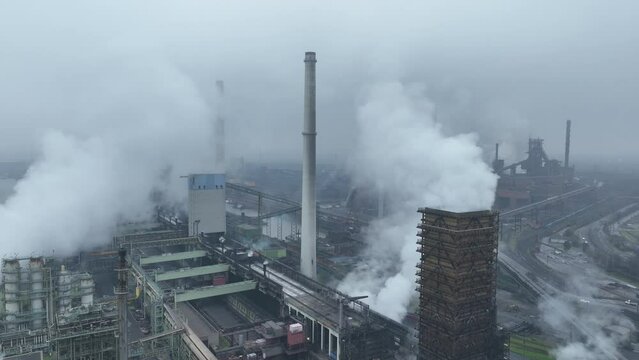 Blast furnice and industrial recycling company. Sintering, zinc production, furnace and casting. Steel industry factory plant. Aerial drone overhead view. Heavy industry in Germany.