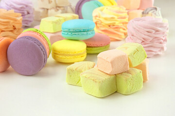 Various of sweetness: macaroons, marshmallows and zephyrs. Homemade colored desserts for the present.