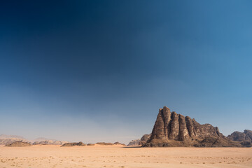 Fototapeta na wymiar Seven Pillars of Wisdom or Jabal al-Mazmar Mountain in the Desert of Wadi Rum, Jordan