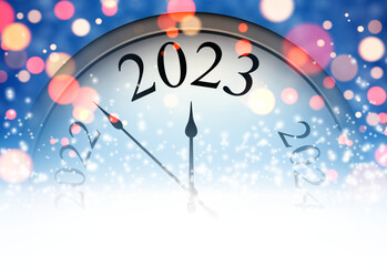 Half hidden clock showing 2023 with colorful bokeh lights.