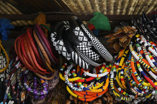 Multicolored beads, souvenirs for sale in shop, market in Senegal, Africa. African traditional national folk handicraft, craft. Ethnic Jewels, bracelets, accessory. Senegalese souvenir. Afro style