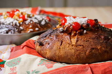 Christmas panettone with nuts, sugar layer and syrupy cherries