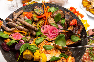 Assorted meat and vegetables, fried in a wok