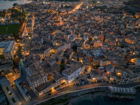 Aerial drone view of the citylights of Corfu city at night. Kerkyra. Corfu island. Greece. © ernestos