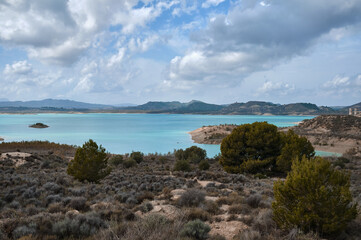 Fototapeta na wymiar turquoise reservoir in the mountains Embalse de la Pedrera reservoir. Alicante Spain