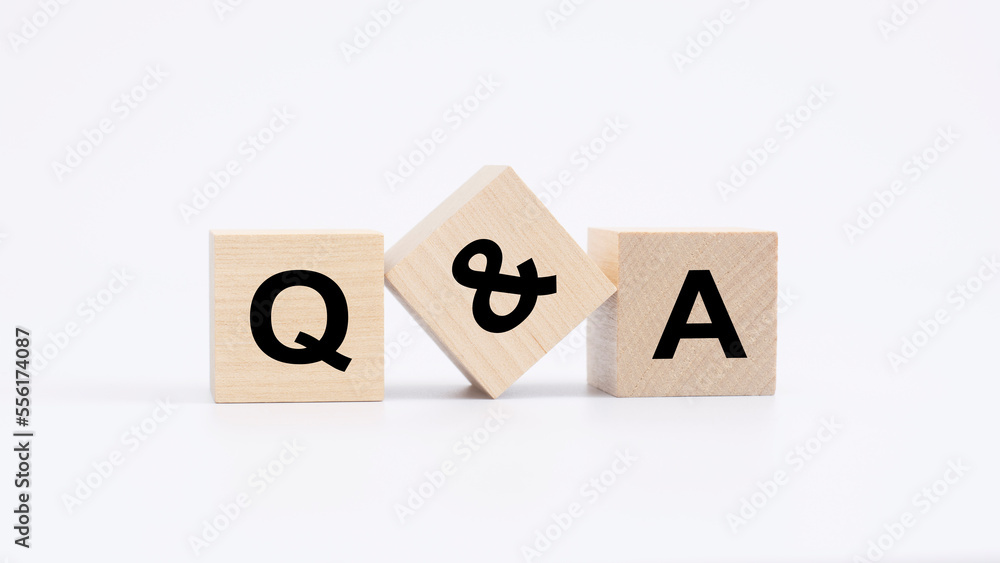 Aufkleber qa - acronym from wooden blocks with letters, questions and answers concept, top view on white backg
