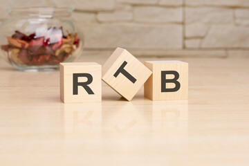 RTB - acronym from wooden blocks with letters, top view on grey background