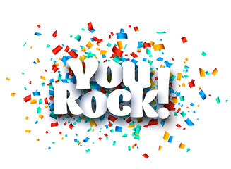 You rock sign on colorful cut ribbon confetti background.