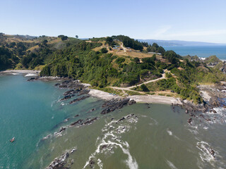 Aerial shot of the picturesque landscape at Isla Maiquillahue in the Pacific Ocean of Chile