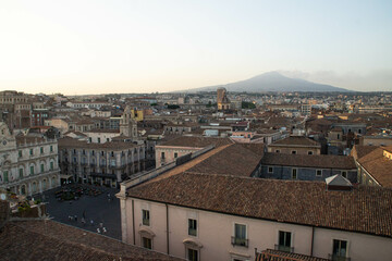 View over Catania and mount Etna from the dome of the Abbey of St Agatha at sunset, Sicily, Italy