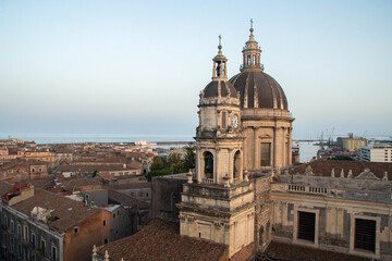 View at Catania Cathedral and Ionian sea from the dome of the Abbey of St Agatha at sunset, Sicily,...